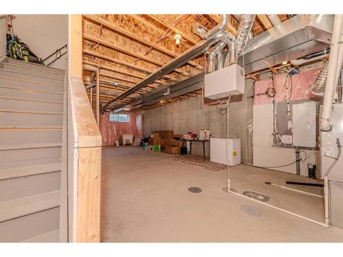 831 Creekside Boulevard Sw, Calgary, AB - Indoor Photo Showing Basement