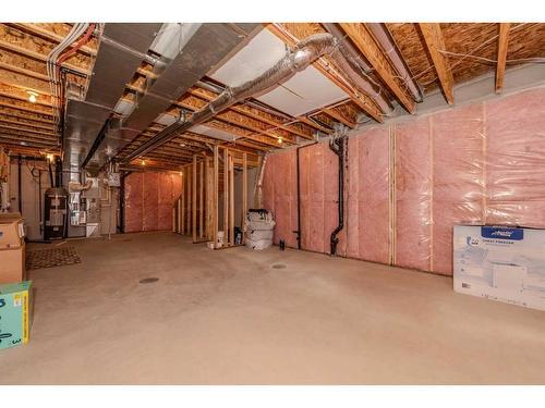 831 Creekside Boulevard Sw, Calgary, AB - Indoor Photo Showing Basement