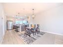 831 Creekside Boulevard Sw, Calgary, AB  - Indoor Photo Showing Dining Room 