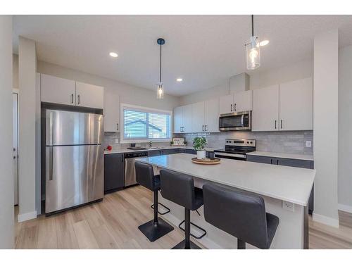 831 Creekside Boulevard Sw, Calgary, AB - Indoor Photo Showing Kitchen With Stainless Steel Kitchen With Upgraded Kitchen