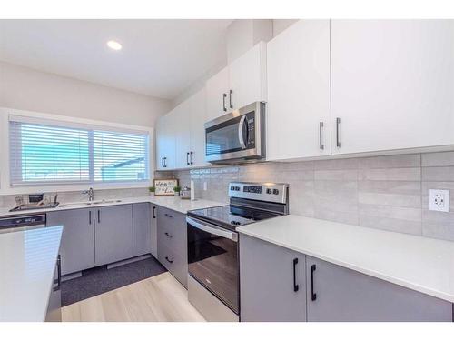 831 Creekside Boulevard Sw, Calgary, AB - Indoor Photo Showing Kitchen With Stainless Steel Kitchen