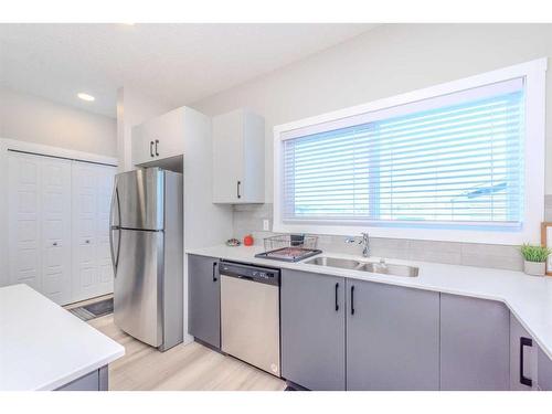 831 Creekside Boulevard Sw, Calgary, AB - Indoor Photo Showing Kitchen With Stainless Steel Kitchen With Double Sink