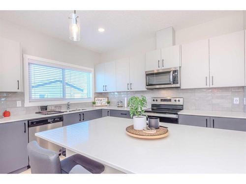 831 Creekside Boulevard Sw, Calgary, AB - Indoor Photo Showing Kitchen With Stainless Steel Kitchen With Upgraded Kitchen