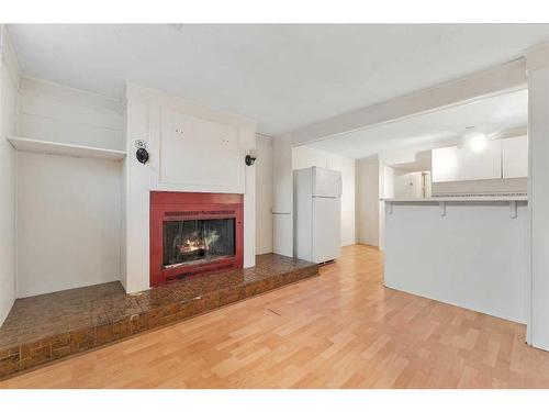 15 Falworth Place Ne, Calgary, AB - Indoor Photo Showing Living Room With Fireplace