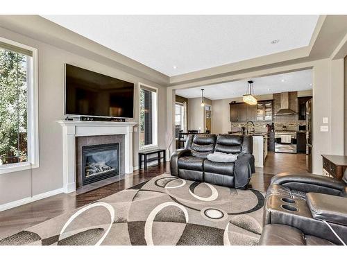 771 Windridge Road Sw, Airdrie, AB - Indoor Photo Showing Living Room With Fireplace