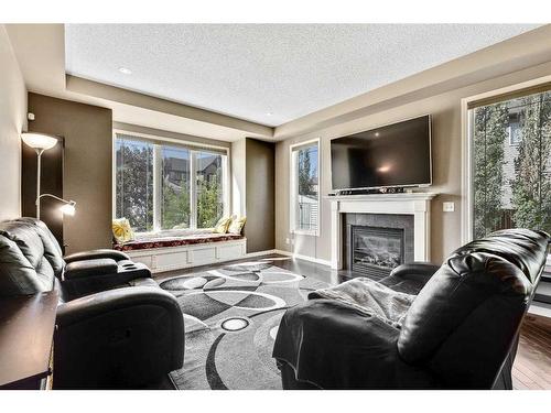 771 Windridge Road Sw, Airdrie, AB - Indoor Photo Showing Living Room With Fireplace