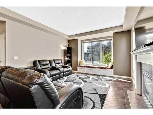 771 Windridge Road Sw, Airdrie, AB - Indoor Photo Showing Living Room With Fireplace