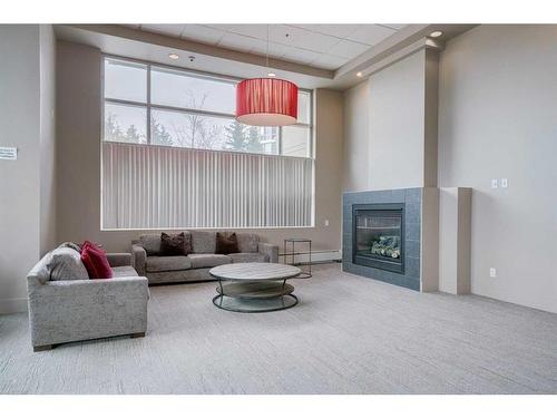 907-1121 6 Avenue Sw, Calgary, AB - Indoor With Fireplace