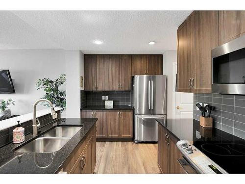 285 Auburn Crest Way Se, Calgary, AB - Indoor Photo Showing Kitchen With Stainless Steel Kitchen With Double Sink