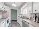 153 Berwick Way Nw, Calgary, AB  - Indoor Photo Showing Kitchen With Double Sink 