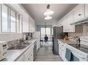 153 Berwick Way Nw, Calgary, AB  - Indoor Photo Showing Kitchen With Double Sink 