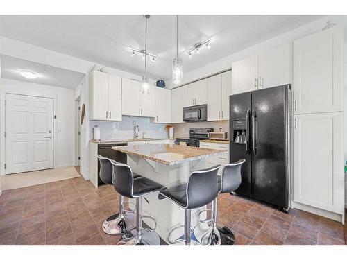 3402-755 Copperpond Boulevard Se, Calgary, AB - Indoor Photo Showing Kitchen With Upgraded Kitchen