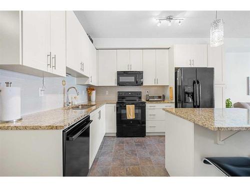 3402-755 Copperpond Boulevard Se, Calgary, AB - Indoor Photo Showing Kitchen With Upgraded Kitchen