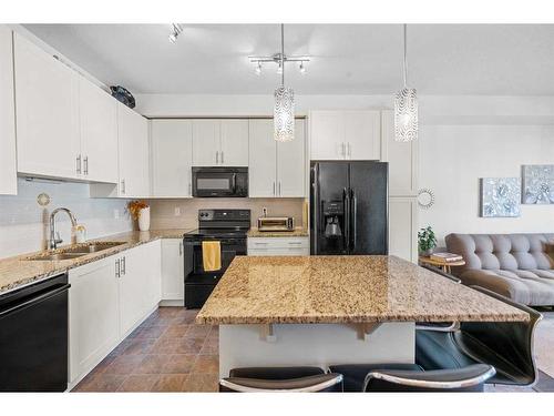 3402-755 Copperpond Boulevard Se, Calgary, AB - Indoor Photo Showing Kitchen With Double Sink With Upgraded Kitchen