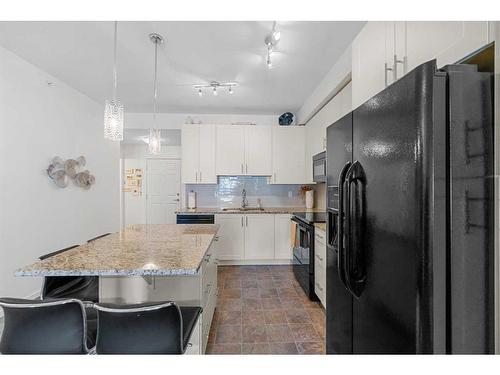 3402-755 Copperpond Boulevard Se, Calgary, AB - Indoor Photo Showing Kitchen With Upgraded Kitchen