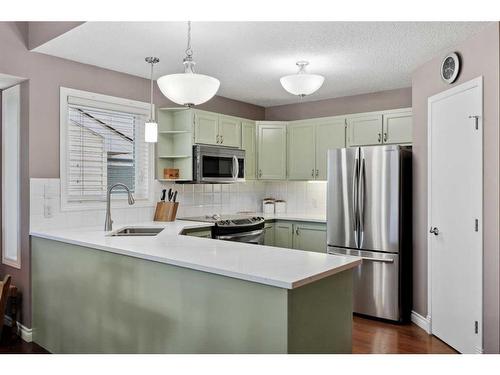 78 Rivercrest Villas Se, Calgary, AB - Indoor Photo Showing Kitchen With Stainless Steel Kitchen With Double Sink With Upgraded Kitchen