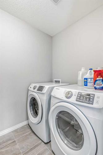 128 Cityside Manor Ne, Calgary, AB - Indoor Photo Showing Laundry Room