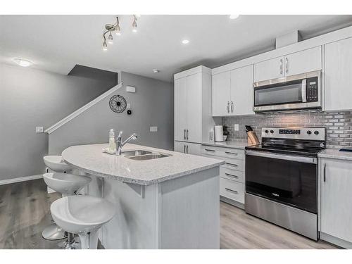 128 Cityside Manor Ne, Calgary, AB - Indoor Photo Showing Kitchen With Double Sink With Upgraded Kitchen