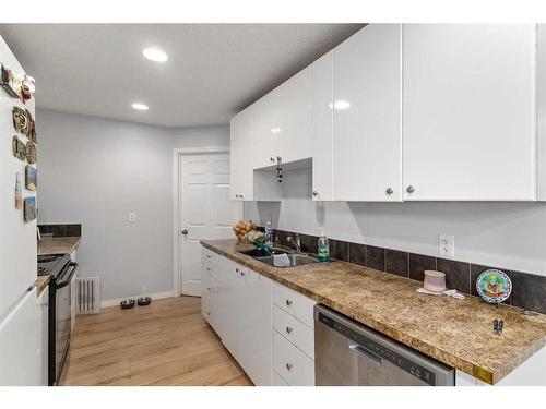 224 Covington Place Ne, Calgary, AB - Indoor Photo Showing Kitchen With Double Sink