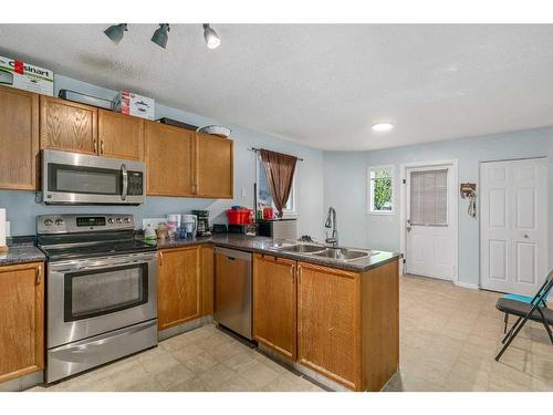 224 Covington Place Ne, Calgary, AB - Indoor Photo Showing Kitchen With Double Sink