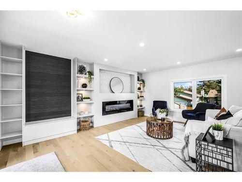 10604 Oakmoor Way Sw, Calgary, AB - Indoor Photo Showing Living Room With Fireplace