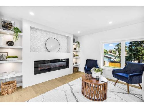 10604 Oakmoor Way Sw, Calgary, AB - Indoor Photo Showing Living Room With Fireplace