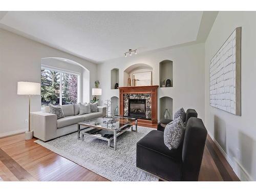 133 Tusslewood Heights Nw, Calgary, AB - Indoor Photo Showing Living Room With Fireplace