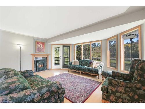 32 Bowbank Crescent Nw, Calgary, AB - Indoor Photo Showing Living Room With Fireplace