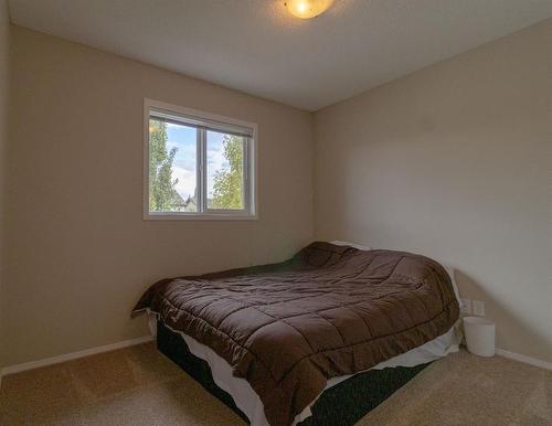 198 Sunset Heights, Cochrane, AB - Indoor Photo Showing Bedroom