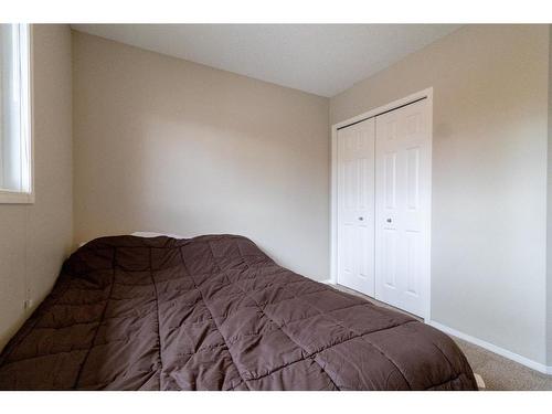 198 Sunset Heights, Cochrane, AB - Indoor Photo Showing Bedroom