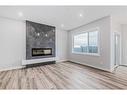 158 Aquila Way Nw, Calgary, AB  - Indoor Photo Showing Living Room With Fireplace 