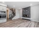 158 Aquila Way Nw, Calgary, AB  - Indoor Photo Showing Living Room With Fireplace 