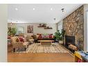 4058 46 Street Sw, Calgary, AB  - Indoor Photo Showing Living Room With Fireplace 