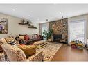 4058 46 Street Sw, Calgary, AB  - Indoor Photo Showing Living Room With Fireplace 