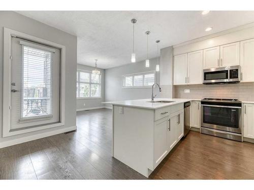 197 Silverado Plains Park Sw, Calgary, AB - Indoor Photo Showing Kitchen With Upgraded Kitchen