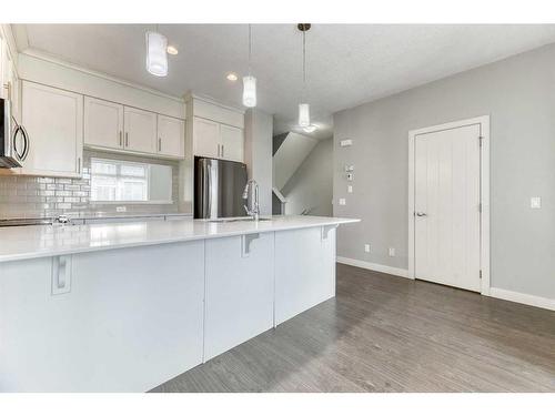 197 Silverado Plains Park Sw, Calgary, AB - Indoor Photo Showing Kitchen With Upgraded Kitchen