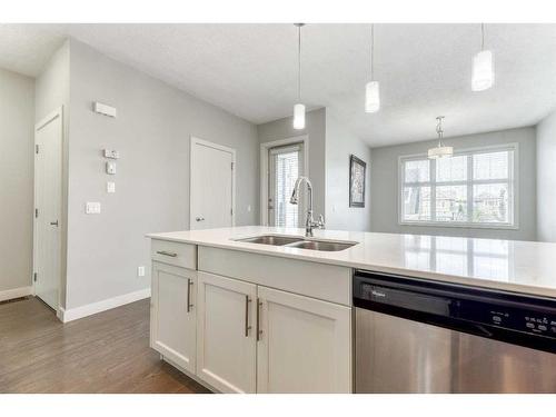 197 Silverado Plains Park Sw, Calgary, AB - Indoor Photo Showing Kitchen With Double Sink With Upgraded Kitchen