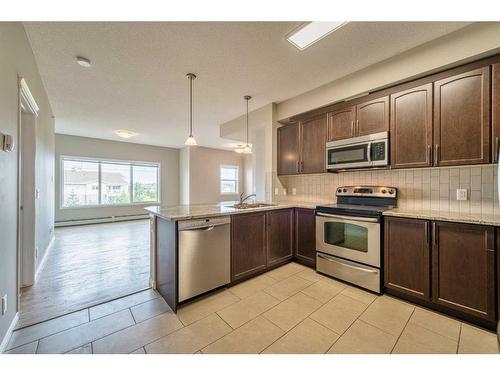 3304-4 Kingsland Close Se, Airdrie, AB - Indoor Photo Showing Kitchen With Stainless Steel Kitchen