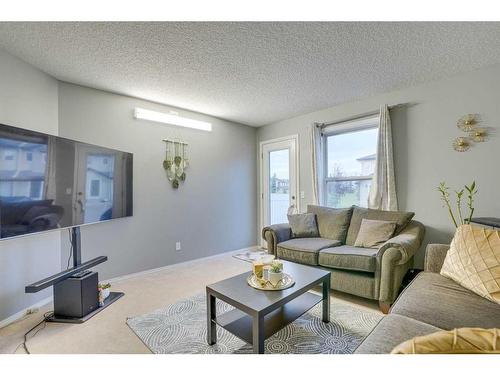 489 Saddlecrest Boulevard Ne, Calgary, AB - Indoor Photo Showing Living Room