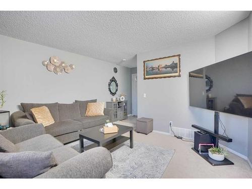 489 Saddlecrest Boulevard Ne, Calgary, AB - Indoor Photo Showing Living Room