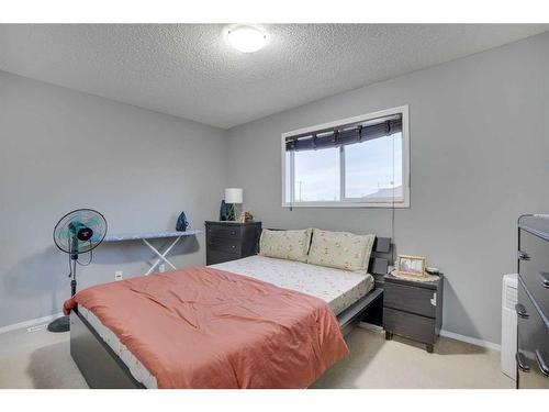 489 Saddlecrest Boulevard Ne, Calgary, AB - Indoor Photo Showing Bedroom