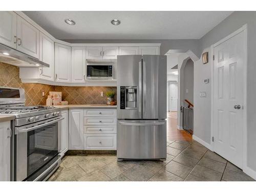 81 Arbour Crest Circle Nw, Calgary, AB - Indoor Photo Showing Kitchen With Stainless Steel Kitchen