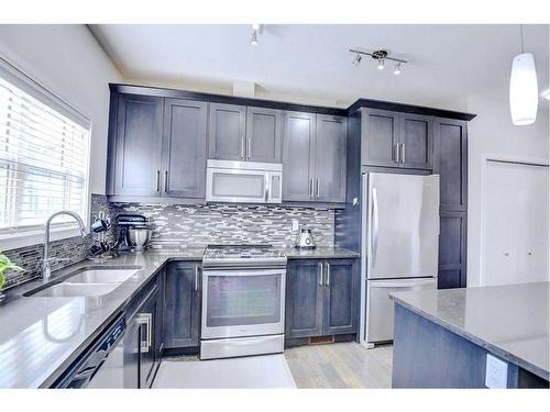 103 Evansridge Court Nw, Calgary, AB - Indoor Photo Showing Kitchen With Stainless Steel Kitchen With Double Sink With Upgraded Kitchen