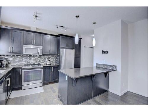 103 Evansridge Court Nw, Calgary, AB - Indoor Photo Showing Kitchen With Stainless Steel Kitchen With Double Sink With Upgraded Kitchen