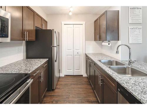 405-10 Kincora Glen Park Nw, Calgary, AB - Indoor Photo Showing Kitchen With Stainless Steel Kitchen With Double Sink With Upgraded Kitchen