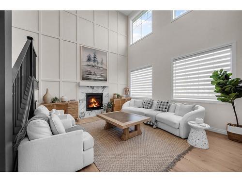 375 Chelsea Passage, Chestermere, AB - Indoor Photo Showing Living Room With Fireplace