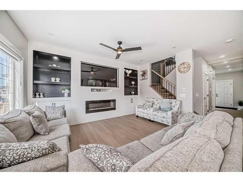 117 Saddlecrest Crescent Ne, Calgary, AB - Indoor Photo Showing Living Room With Fireplace