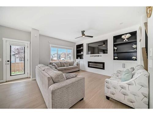 117 Saddlecrest Crescent Ne, Calgary, AB - Indoor Photo Showing Living Room With Fireplace