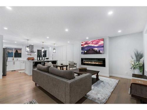 7027 Huntbourne Green Ne, Calgary, AB - Indoor Photo Showing Living Room With Fireplace