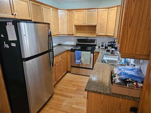 1315-68 Street Street Ne, Calgary, AB - Indoor Photo Showing Kitchen With Double Sink